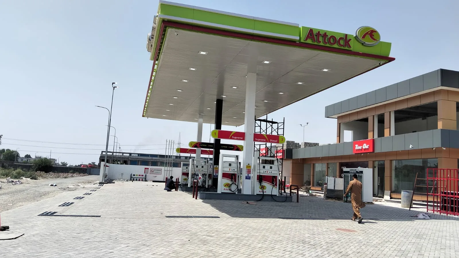 Daytime view of the Attock Petroleum Lake City canopy and forecourt