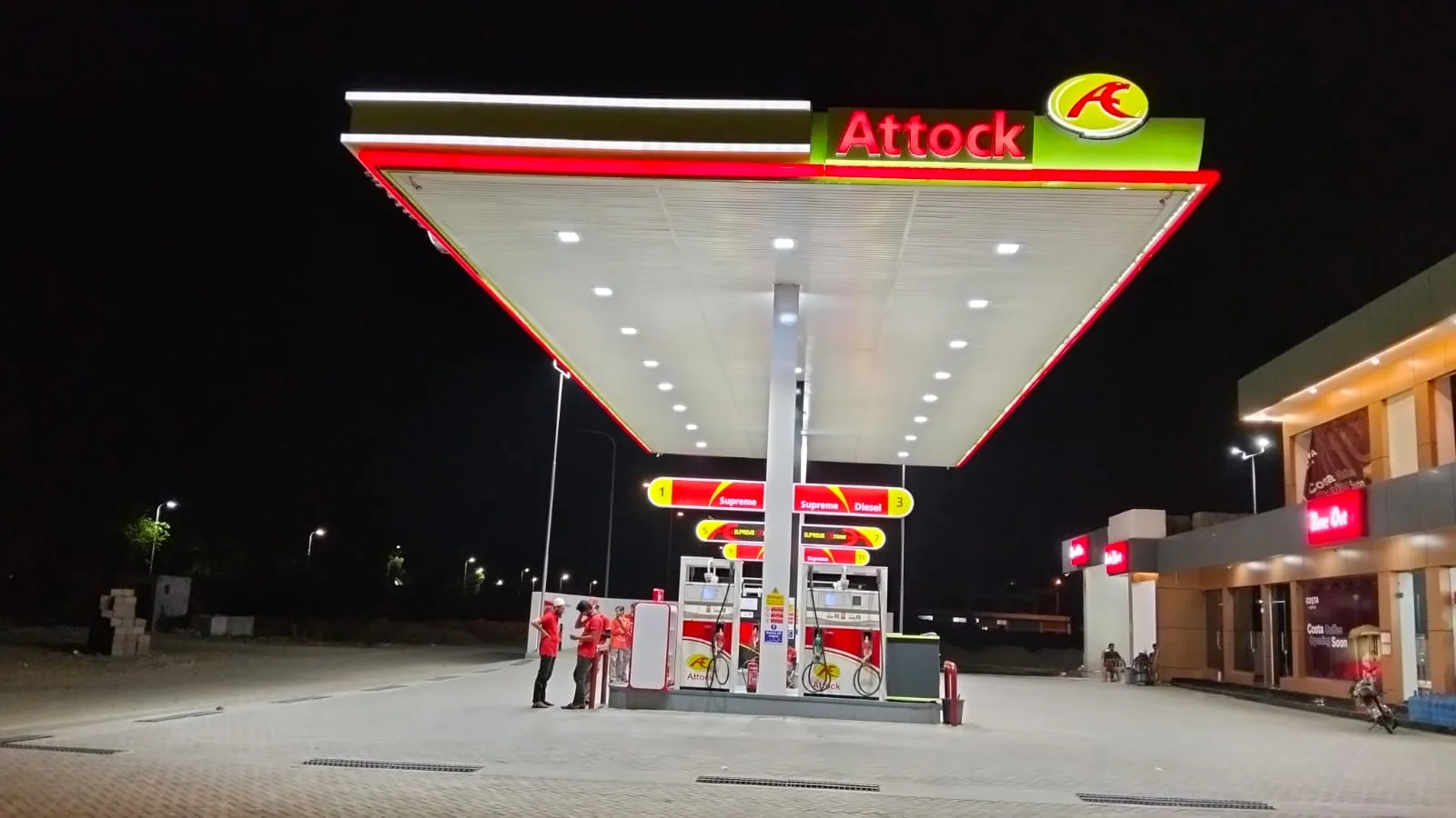 Attock Petroleum Lake City canopy lit at night