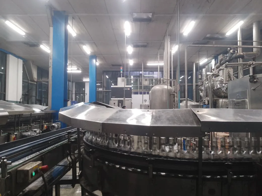 Stainless fill equipment on the Lotte Akhtar Beverages production floor